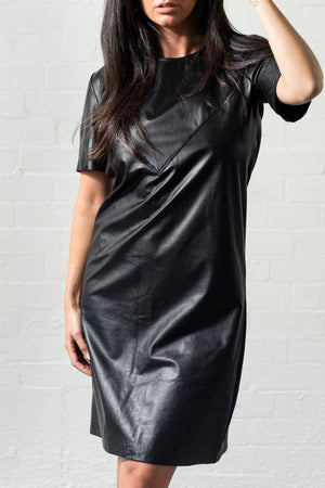 Open image in slideshow, A flattering black dress with triangular angled detailing to empathise the curves as the leather glides softly over your shape
