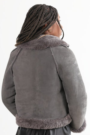 Open image in slideshow, This Grey sheepskin Shearling jacket has Raglan sleeves and plenty of fur trim detailing.
