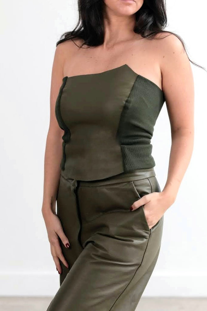 A comfortable slip on corset made from soft ethical leather or suede and stretch rib.