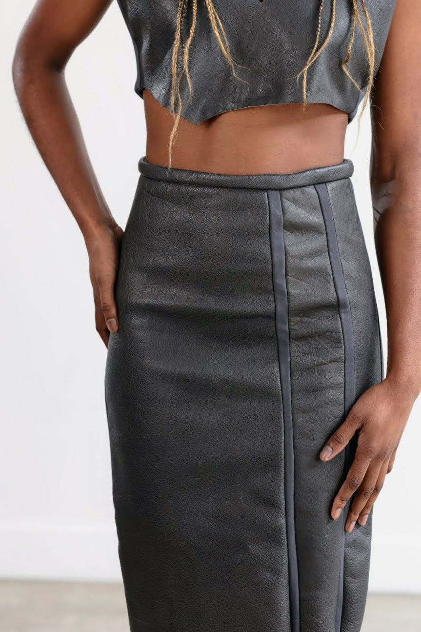 Pencil skirt with narrow fitted waist and side back zip.