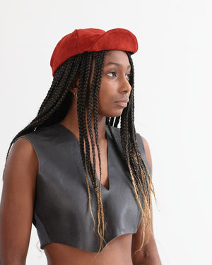 Grey vest paired with red suede bike cap in Australian suede.