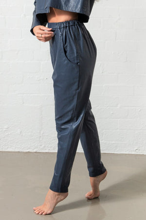 Elastc waisted blue leather slouch style pants with pockets