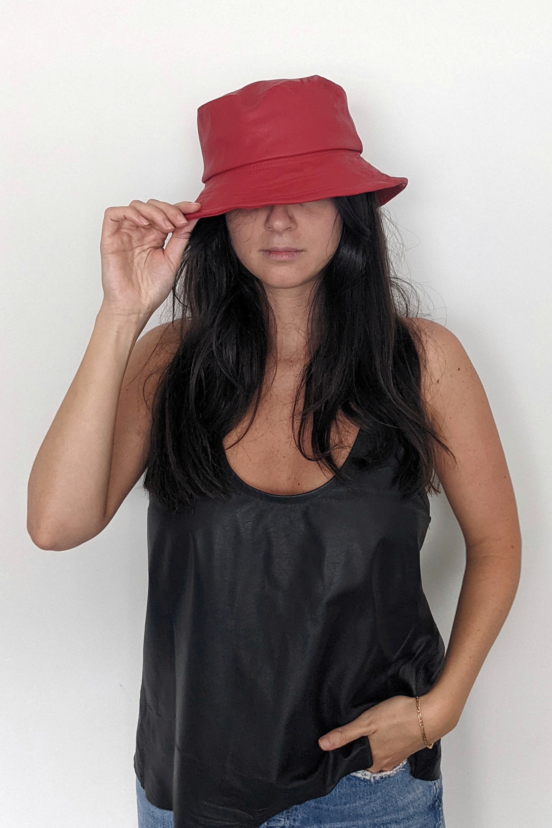 Wide brim and terry towelling cloth keep you and this leather bucket hat cool