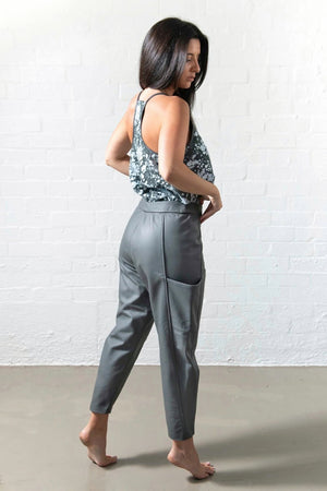Back shot with movement of leather pants and exaggerated pockets