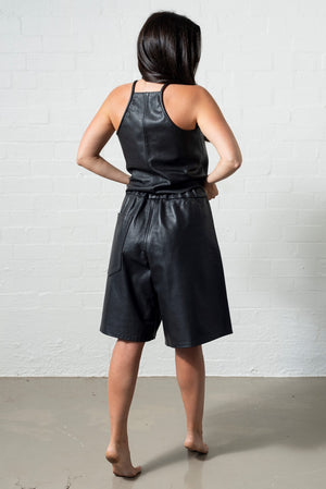 Urbane mid length leather shorts with razor back tank top, both in black leather