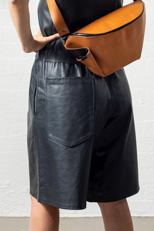 Open image in slideshow, Over sized rear pocket long leather shorts with mustard bumbag
